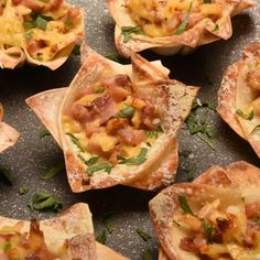 small appetizers with meat and cheese on them sitting on a counter top, ready to be eaten