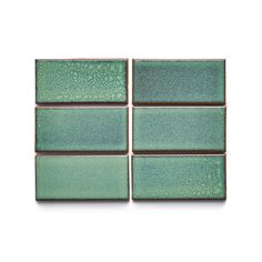 four green tile tiles on a white background