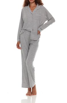 A matching pajama set crafted from a luxurious satiny knit ensures even your bedtime wardrobe is chic! 29" inseam (size Small) Two-piece set Top has front button closure 62% polyester, 33% rayon, 5% spandex Machine wash, tumble dry Imported Model stats: 5'10" height, 32" bust, 25" waist, 36" hip. Model is wearing size Small. Comfortable Pajama Party Sets With Long Pants, Comfortable Long Pants Sets For Pajama Party, Comfortable Matching Loungewear Set, Cotton Loungewear Pant Set, Relaxed Fit Sets With Long Pants For Relaxation, Relaxed Fit Long Pants Set For Relaxation, Relaxed Fit Sleep Set With Long Pants, Comfortable Sleepwear Matching Set For Loungewear, Relaxed Fit Pants Matching Set For Loungewear