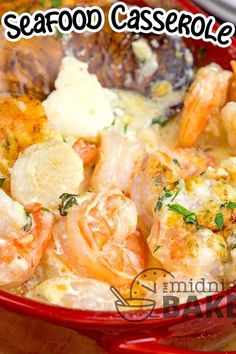 a red bowl filled with shrimp and potatoes