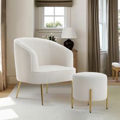 a white chair and ottoman in a living room