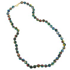 Add a touch of classic Venetian style to your outfit with this elegant Murano millefiori necklace. Centuries-old Murano glass technique perfected by Italian master craftsmen is used to create colorful mosaic effect that is fun and trendy, yet classic and timeless. This is a unique necklace that will add Venetian chic to your jewelry collection and will brighten up your look and your day. Measurements: Each necklace measures 24 inches in length and comes with an attractive velvet pouch and a cert Multicolor Murano Glass Round Necklace, Elegant Multicolor Czech Glass Necklaces, Elegant Multicolor Glass Necklaces, Elegant Green Murano Glass Necklace, Single Strand Murano Glass Necklaces With Round Beads, Round Czech Glass Single Strand Necklaces, Round Single Strand Czech Glass Necklace, Round Single Strand Czech Glass Necklaces, Traditional Single Strand Glass Necklace