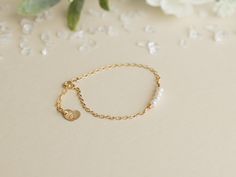 "Pearl and Gold Baby Bracelet/ 14 K Gold Filled Toddler Bracelet/ Little Girl Bracelet with Initial/ Baby Bracelet with Heart Charm Precious little bracelet is perfect for newborn gift, baptism/christening gift, 1st birthday gift, or just to show you care gift!! Stunning as flower girl bracelet too!! Really any occasion! Four delicate, 4 mm fresh water pearls, either cream or peach, adorn this gold filled bracelet. Bracelet comes in your choice of either Gold filled or Sterling Silver. The chain Toddler Bracelet, Flower Girl Bracelets, Girl Bracelet, Bracelet With Heart, Bracelet Pearl, 1st Birthday Gifts, Baby Bracelet, Gold Baby, Water Pearls