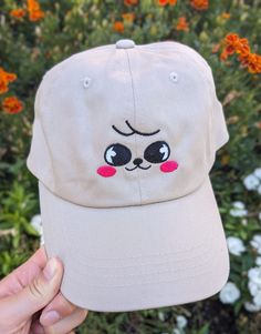 If you love Stray Kids and therefore Skzoo, this was made for you. Perhaps the CUTEST way to rep your bias in a subtle way. This is made from a 100% chino cotton twill brown cap.  If you have more than one bias (which who doesn't), or want to match with someone else, I do have the whole skzoo collection up in my shop! Most members I have as both a cap and a bucket hat, so whatever you need, I have covered.  This product is made especially for you as soon as you place an order, which is why it takes us a bit longer to deliver it to you. Making products on demand instead of in bulk helps reduce overproduction, so thank you for making thoughtful purchasing decisions! Cute Hats With Embroidered Logo And Curved Brim, Cute Embroidered Adjustable Baseball Cap, Cute Baseball Cap With Embroidered Logo, Cute Cotton Trucker Cap, Cute Cotton Trucker Hat, Cute Cotton Snapback Hat, Cute Cream Hat For Gift, Cute Snapback Hat With Curved Brim, Cute Adjustable Baseball Cap With Embroidered Logo