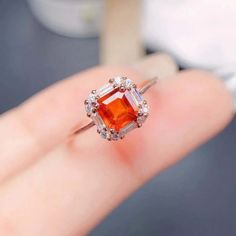 ✦ The garnet gemstone in this ring seems to be a pretty even mix resulting in a gorgeous pinkish orange that shifts to a brownish pink depending on the light source. ----------- DESCRIPTIONS -----------▪ Gemstone: Spessartite (Garnet)▪ Stone Shape: Radiant▪ Gem Size: 5*5 mm▪ Ring Size: Adjustable/ 5 - 15 US Size ▪ SKU: FME - R359▪ Base Metal: 925 Sterling Silver▪ Plating: 18K Platinum Vermeil / 18K Gold Vermeil/ 18K Rose Gold Vermeil ----------- MEANING -----------♥ Zodiac: January♥ Birthstone M Elegant Garnet Crystal Ring With Gemstone, Orange Garnet Ring, Rectangular Garnet Rings In Red, Gold Garnet Multi-stone Ring, Orange Gemstone-accented Ring Jewelry, January Birthstone Rings, Spessartite Garnet, Shiny Objects, Nose Rings Hoop