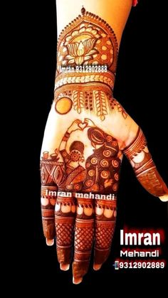 a woman's hand with henna on it