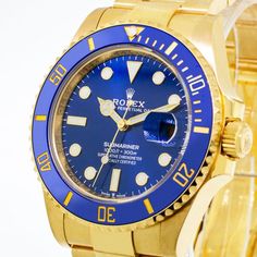 Description Guaranteed Authentic Men's Rolex Submariner with a 41mm 18K yellow gold case and a blue stick dial. This fine timepiece is brand-new and features an 18K yellow gold and blue Cerachrom bezel and an 18K yellow gold Oyster bracelet. This watch is unworn with tags and Rolex box and. It comes with a Two Year Warranty from Da Vinci Fine Jewelry, Inc., a Rolex box, instructions, and certified retail appraisal from Da Vinci Fine Jewelry, Inc. Details BRAND Rolex COLLECTIONS Submariner Date M Luxury Blue Chronometer Watch, Luxury Automatic Blue Watches, Luxury Blue Automatic Watches, Luxury Blue Watch Accessories With Date Indicator, Men's Rolex, Rolex Submariner Date, College Rings, Swiss Luxury Watches, Rolex Submariner No Date