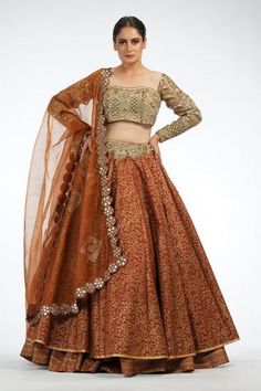 Dark cinammon silk layered lehenga with floral printed motifs. Paired with blouse in mirrorwork, zari, cutwork detailing and dupatta.
Components:3
Pattern:Printed
Type of Work:Floral motifs
Neckline:Sweetheart
Sleeve Length:Three quarter
Fabric:Silk, organza
Color:Brown
Other Details:
Embroidered waistband
Scallop bordered dupatta
Sheer dupatta
Back cut-out
Occasion:Sangeet - Aza Fashions Layered Lehenga, Sheer Dupatta, Fashionable Saree Blouse Designs, Embroidered Lehenga, Desi Clothes, Contrast Blouse, Embroidered Wedding, Wedding Lehenga, Organza Dupatta