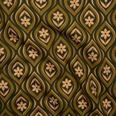 an image of a green and brown fabric with flower designs on the side, as seen from above