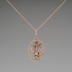 This gorgeous Carlo Viani necklace is crafted of 14k rose gold and features a floral diamond motif. The pendant is set with 6 fancy brown pear cut diamonds, 2 fancy brown round brilliant diamonds, and 94 smaller round brilliant accent diamonds. The total diamond weight is 1.89 carats. The pendant is in excellent condition and hangs from a 14k rose gold 18-inch chain. Ask us about a matching Carlo Viani ring. Luxury Oval Diamond Necklace With Rose Cut, Luxury Brown Jewelry With Brilliant Cut, Luxury Brown Jewelry With Diamond Accents, Brown Diamond Jewelry For Formal Occasions, Formal Brown Diamond Jewelry, Luxury Diamond Necklace With Rose Cut Flower Pendant, Luxury Rose Cut Diamond Flower Pendant Necklace, Elegant Oval Brown Jewelry, Elegant Brown Oval Jewelry