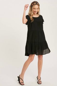 Meet your new everyday dress! Product Details: Color: Black Woven dress Round neckline Drop Shoulder with ruffle hem sleeves Side seam pockets Tiered flounce hem Flowy silhouette Lined Lightweight Keyhole at back Button closure Fabric Content: 65% Rayon / 35% Polyester Tiered Babydoll Dress, Black Baby Dolls, Everyday Dress, Woven Dress, Everyday Dresses, Babydoll Dress, Ruffle Hem, Doll Dress, Diy Clothes