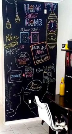 a blackboard with writing on it in a room