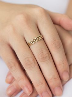 a woman's hand with a ring on it