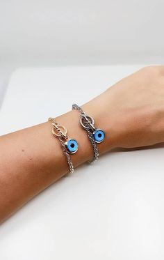 Blue eye jewelry is tarnish resistant,can't be faded in a long time. The lenght of the nazar bracelet is 18 cm(7 in) Evil eyes are believed to protect the person who carries them. They are also believed to bring good luck and deflect the negative energy. Evil eye charm bracelet can be a perfect gift choice for Christmas or birthday. 🌀Evil eye charm is over 5000 years old. It is found in all major religions and cultures. Blue evil eye or lucky evil eye is a Mediterranean amulet for protection ag Blue Metal Bracelets With Evil Eye, Blue Metal Bracelet With Evil Eye, Blue Evil Eye Metal Bracelet, Blue Metal Spiritual Bracelets, Spiritual Blue Metal Bracelets, Blue Metal Evil Eye Bracelet, Metal Charm Bracelet With Evil Eye, Evil Eye Metal Charm Bracelet, Nazar Bracelet