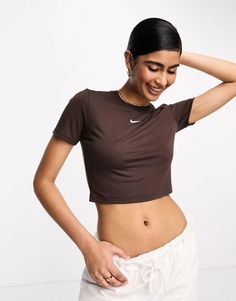 Tops.by.Nike.Your new go-to.Crew neck.Short sleeves.Nike logo embroidery to chest.Slim fit.Product Code: 127913928 Sporty Brown Short Sleeve Top, Nike Crop Top For Spring, Trendy Fitted Nike Tops, Brown Athleisure Crew Neck Top, Brown Crew Neck Athleisure Top, Brown Crew Neck Top In Athleisure Style, Sporty Brown Top For Spring, Sporty Brown Tops For Spring, Brown Fitted Short Sleeve Crop Top