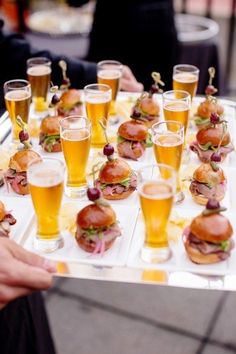 a tray filled with lots of different types of food and drinks on top of it