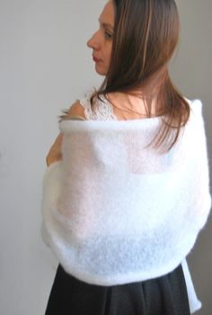 Pure white bridal shawl, pure white wedding women shrug, white bridal bolero, wedding cape shawl, wedding wrap mohair, bridal scarves shawl, This light white wedding shawl is made of soft kid mohair and silk yarn. (75 % soft mohair and 25 % silk). It will look good with any type of clothing for many occasions: wedding, theater, garden party, birthday party. Lovely, breeze and comfortable, long and wide knitted natural scarf/shawl/wrap. Measurements: Width: 70 cm = 27.5 inches Length: 200 cm = 78 Fitted White Shawl, White Shawl Wrap, Elegant White Shawl Wrap, White Hand Knitted Shawl For Wedding, White One-size Shawl Wrap, Wedding Shrug, Bridal Cover Up, Bolero Wedding, Knit Shrug