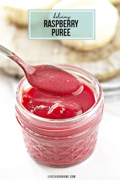 raspberry puree in a jar with a spoon