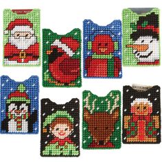 cross stitch christmas coasters with santa, snowman, and other holiday related items