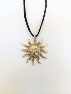 Brass pendant,pendant in shape of Sun, symbol of happiness.Sun smile,Pagan fortune talisman,gift for girl,woman.Jewelry.Handmade, for dear Pendant in the shape of the Sun. It is made of raw, 100% natural brass. The strap made of brown leather. The Sun is symbol of happiness, well-being and fortune. This charming pendant could be a wonderful gift for everyone who likes jewelry made of brass. The pendant ships in a gift box. Made with love for you! If you have any questions regarding this item, pl