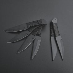 two knives are sitting next to each other