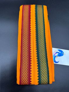 Red & Orange color cotton Angavastram with maroon and green combination borders on both sides This is only Angavastram with out Dhoti/ Pancha Handmade item  Hand loom cotton  size: 1.8 meters  🌸 C A R E . T I P S  🌸 We don't want your special moments to fade. To maintain the quality of your products , please : - Avoid contact with perfumes, other chemicals, including household cleaners. - Do not use chemical jewelry cleaners. - Gently polish with a soft, lint-free cloth after every use. Please do not use a metal polishing cloth. - Store your beloved products in a cool dry place. O U R . P R O M I S E   We believe that customer satisfaction is our utmost priority. So all our products are quality checked, compactly packed and safely shipped so that it reaches you in perfect condition. D I