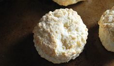 three biscuits sitting on top of a table next to each other