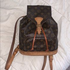 Code: Sp0938 Vintage Authentic Lv Montsouris Mm Backpack. Loved During The Years, Does Show Signs Of Wear On The Vachetta. The Canvas However Is Beautiful And In Excellent Condition. Please Review All Picture Carefully! There Is Some Cracking On Some Areas On The Straps As Well As The Leather Trim Where It Cinches, The Bottom Has Some Rubbing As Well. This Bag Has Many Years Left In It! It’s Beautiful! (The Pull Strap Is Real Leather Vachetta However It Is A Replacement Strap Not Lv Brand) Louis Vuitton Backpack, Brown Purses, Authentic Louis Vuitton, Vintage Beauty, Sling Bag, Leather Trims, Real Leather, Louis Vuitton Monogram, Fashion Backpack