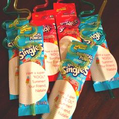 several different types of toothbrushes in plastic bags on a wooden table next to each other