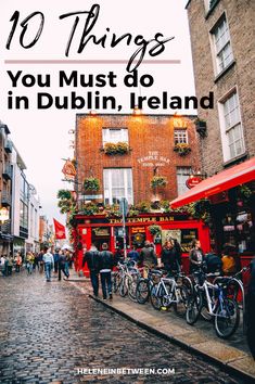 people walking down a cobblestone street in dublin with the words 10 things you must do in dublin, ireland