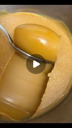 a spoon full of peanut butter being stirred in a bowl with the lid open and melted