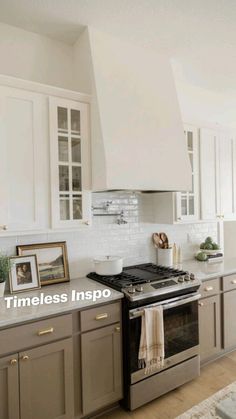 a kitchen with an oven, stove and pictures on the counter top in front of it