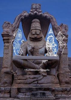 the statue is sitting in front of a blue sky with white outline drawings on it