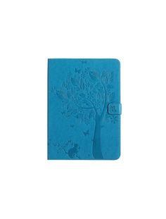 a blue notebook with an image of a tree on it