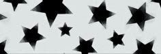 black and white stars are flying in the air