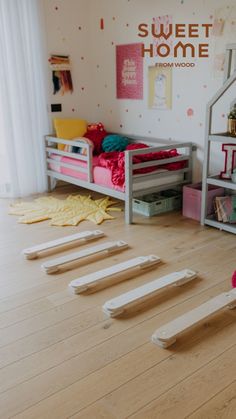 a child's bedroom with bunk beds and toys on the floor