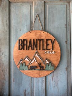 a wooden sign hanging on the side of a door that says, branley cole