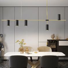 an elegant dining room with modern lighting fixtures and marble table in front of white walls