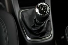 the gear stick on this car is black and chrome