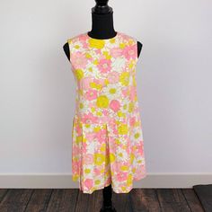 "100% cotton twill. Quik zipper. This is such a fun retro piece - such an awesome vintage find. There is no size tag, this is handmade. Fabric has no stretch. This is a romper or skort. Please compare measurements to a favorite dress: Chest (underarm to underarm): 17\" across Waist (across the front): 17.5\" Shoulder to Shoulder: 13.75\" Length (top of shoulder to bottom hem): 31.25\" Inseam: 5.5\" Condition: Has yellowing around the underarms and some dinginess on the cuffs. Has vintage storage Multicolor Mod Cotton Dresses, Multicolor Cotton Mod Dress, Mid-century Sleeveless Cotton Dress, 1970s Style Sleeveless Cotton Dress, Spring Retro Print Mini Dress, 70s Inspired, Mod Multicolor Floral Print Dress, Floral Sleeveless Dress, 1970s Fitted Floral Print Dresses, Skort Romper