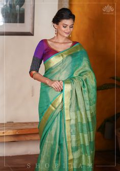 Iridescent and Gossamer, this saree with Green Linen Yarn and Golden Tissue yarn, is a versatile one that can be adorned for many occasions. It comes in soothing pastel shade and the golden tissue yarn adds a mild shimmer to it. This saree is ready to wear with fall and pico done. Handmade silk tassels adorn the pallu and add more grace to it. An unstitched blouse fabric is included.*Note: There may be minor variations in the shade, the texture of the product. Hues/textures show differently due Designer Blouses Online, House Of Blouse, Latest Model Blouse Designs, Silk Tassels, Linen Saree, Linen Yarn, Pastel Shades, Linen Blouse, Blouse Online