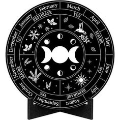 a black and white image of the zodiac wheel with stars, moon phases, and other symbols