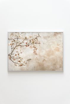 an art piece with white flowers on it in a wall above a chair and table