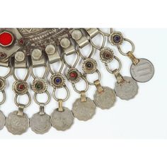 A Moroccan Tribal jewelry vintage a chocker inlaid with colorful glass beads in red and green and dangling coins. Silver, but not of the standard of sterling and richly embellished with applied silver designs and filigree.  Chocker size: 10" height x 10" wide including coins. chocker only is 8" x 8". German nickel coin silver. A Moroccan beautiful ethnic metal silvered jewelry choker.It is a traditional piece of jewelry that is worn around the neck handmade by skilled artisans in Morocco and ref Traditional Red Filigree Jewelry, Traditional Red Jewelry For Collectible, Traditional Red Jewelry For Collectors, Red Bohemian Jewelry For Collectors, Vintage Ceremonial Jewelry With Coin Pendant, Red Bohemian Collectible Jewelry, Festival Medallion Coin Pendant Jewelry, Festival Coin Pendant Medallion Jewelry, Vintage Red Jewelry With Dangling Beads