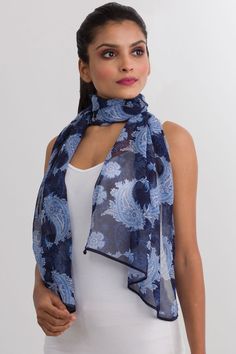 Our Sahila Scarf is made with 100% Cupro material which is a luxurious fabric that is made from the linter fiber of the cotton seed. This fabric has the look and feel of silk, but the lightness, easy care, and breathability of cotton. Featuring a beautiful paisley print, this fair trade scarf is very lightweight, silky, and soft. Dimensions: 20" x 60" Casual Paisley Print Scarves For Summer, Casual Summer Scarves With Paisley Print, Casual Summer Paisley Print Scarves, Elegant Blue Paisley Print Scarves, Paisley Scarf, Fair Trade Clothing, Paisley Scarves, Printed Tunic Tops, Luxurious Fabric