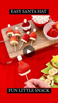 an easy santa hat snack is shown with strawberries, bananas and marshmallows