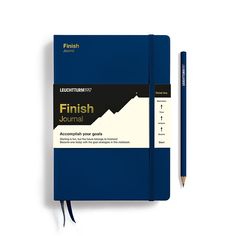 a blue notebook with a pencil on top of it and the words finish journal written in black