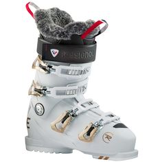 a pair of white ski boots with fur on top