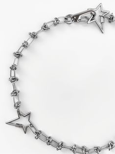 Reach for the stars, and then wear them on your neck. Featuring three stunning star pendants paired alongside our best-selling barbed wire chain, the 'CELESTIAL' necklace is the perfect statement-making piece to complete any look! Made with palladium plated over brass star pendants and stainless steel barbed wire chain and clasp. Available in lengths 14", 15", 16", 18", 20", 22". Handmade in Los Angeles.