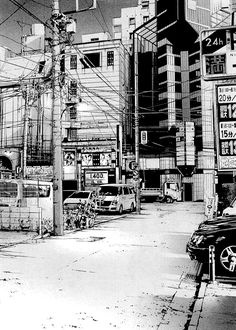 a black and white photo of cars parked on the side of a road in front of tall buildings